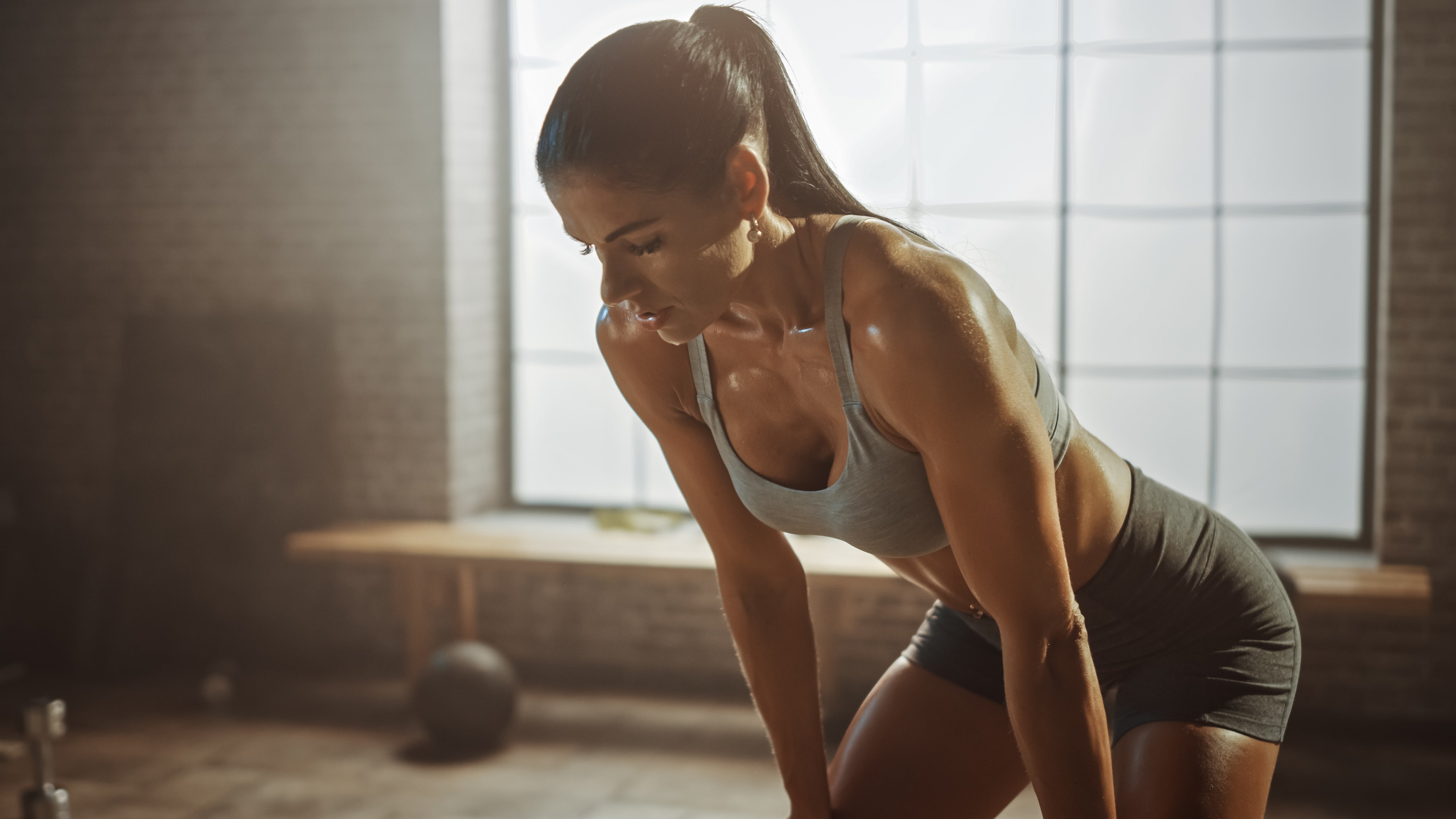 A very hot and sweaty woman in workout gear is bending over and resting during workouts. Sweating is normal and the Purra Antimicrobial Technology will protect your body from any odor or other unwanted issues.